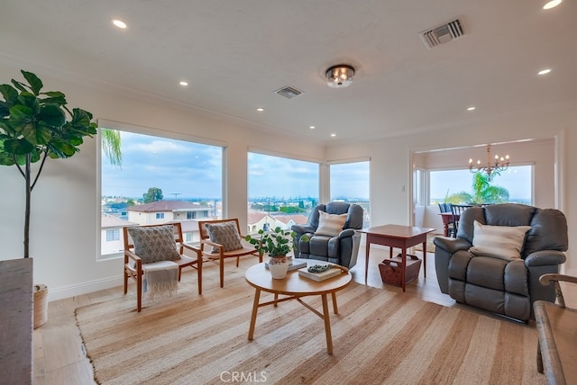 1906 S Patton Ave, San Pedro, CA 90732 - living area featuring plenty of natural light, ornamental molding, a chandelier, recessed lighting, and light wood-type flooring