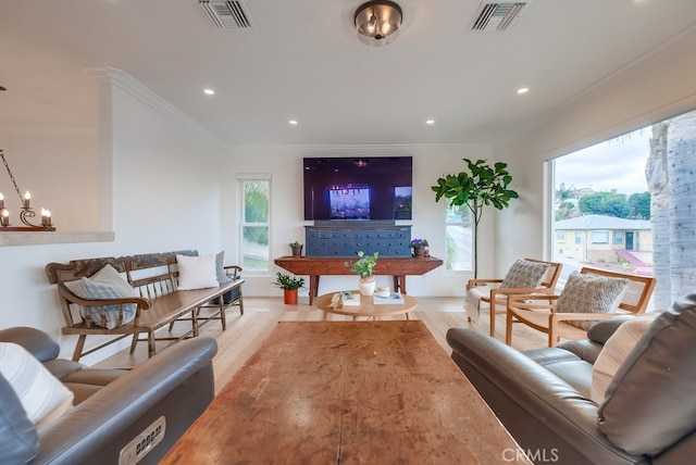 1906 S Patton Ave, San Pedro, CA 90732 - living room featuring wood finished floors, crown molding, healthy amount of natural light, recessed lighting, and a chandelier