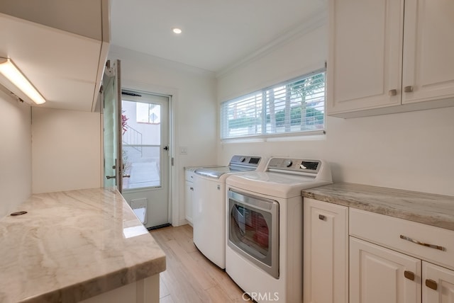 1906 S Patton Ave, San Pedro, CA 90732 - laundry room featuring washing machine and clothes dryer, ornamental molding, light wood finished floors, and cabinet space