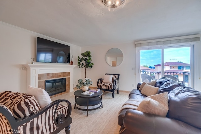 1906 S Patton Ave, San Pedro, CA 90732 - living room featuring a tile fireplace, light wood finished floors, and crown molding