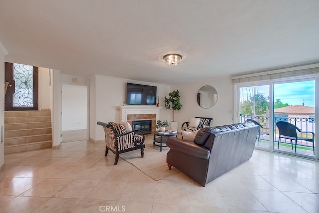 1906 S Patton Ave, San Pedro, CA 90732 - living room featuring light tile patterned flooring, a tile fireplace, and stairway