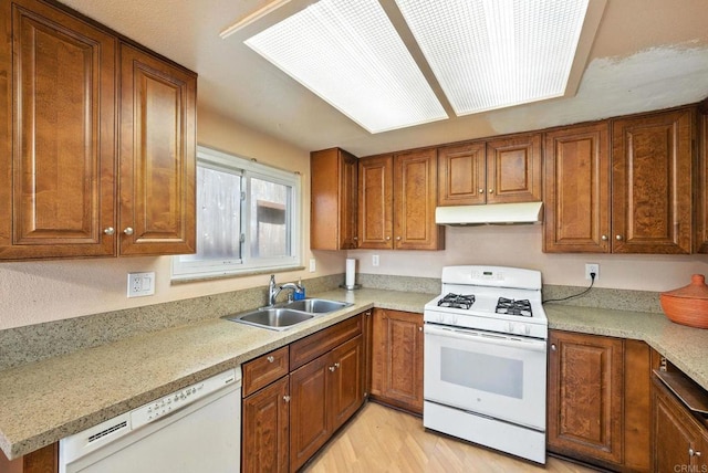 250 65th St, San Diego, CA 92114 - kitchen featuring white appliances, under cabinet range hood, brown cabinets, light countertops, and light wood-type flooring