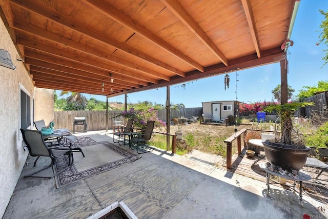 250 65th St, San Diego, CA 92114 - fenced backyard featuring a storage shed, a patio area, and a grill