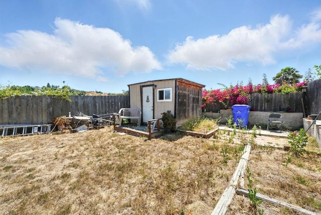 250 65th St, San Diego, CA 92114 - fenced backyard with a storage shed and a vegetable garden