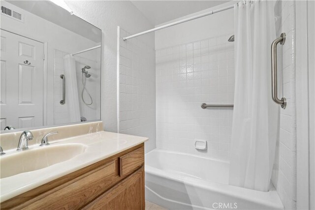 2065 N Shorewood Ave, Upland, CA 91784 - bathroom with shower / bath combination with curtain and vanity