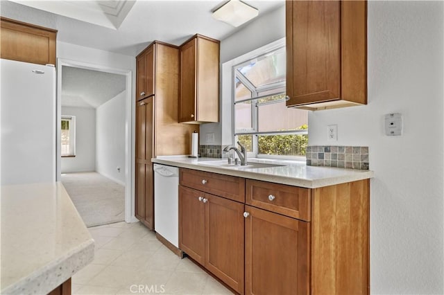 2065 N Shorewood Ave, Upland, CA 91784 - kitchen with white appliances, healthy amount of natural light, and brown cabinets