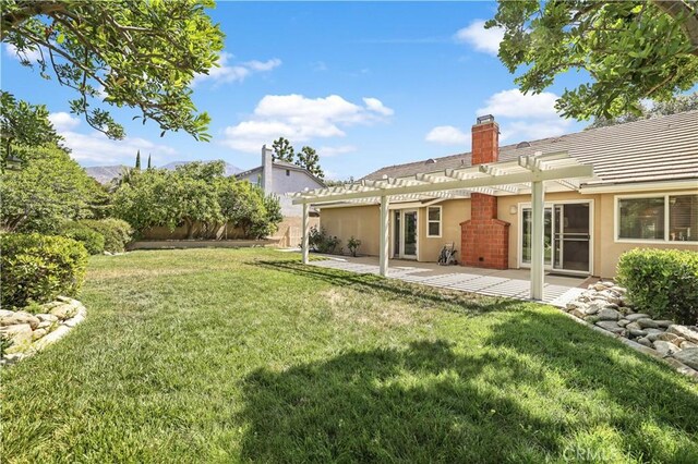 2065 N Shorewood Ave, Upland, CA 91784 - view of green lawn with a pergola and a patio