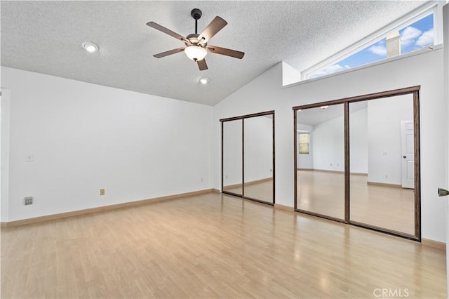2065 N Shorewood Ave, Upland, CA 91784 - unfurnished bedroom with a textured ceiling, multiple closets, wood finished floors, ceiling fan, and high vaulted ceiling