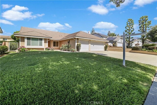 2065 N Shorewood Ave, Upland, CA 91784 - ranch-style house with a garage, concrete driveway, and a tiled roof
