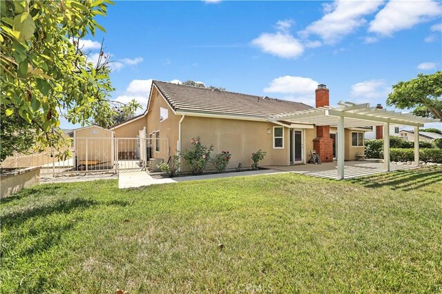 2065 N Shorewood Ave, Upland, CA 91784 - back of property featuring a pergola, stucco siding, a patio, a chimney, and a tiled roof