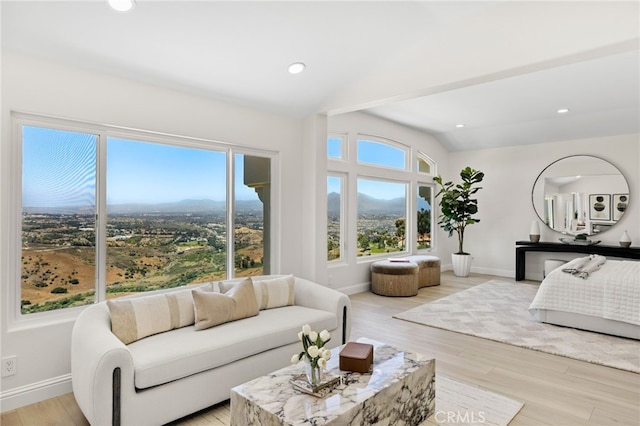 7 Sierra Vis, Laguna Niguel, CA 92677 - living area with light wood-style flooring, a mountain view, and vaulted ceiling