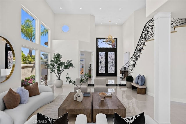 7 Sierra Vis, Laguna Niguel, CA 92677 - living area with stairs, a towering ceiling, a chandelier, and recessed lighting