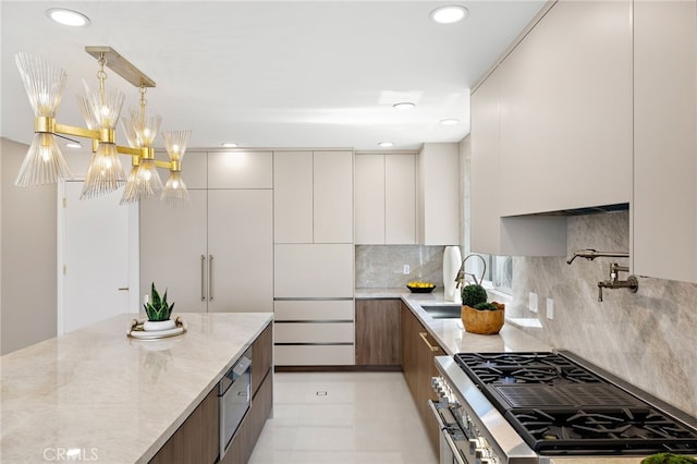 7 Sierra Vis, Laguna Niguel, CA 92677 - kitchen with modern cabinets, appliances with stainless steel finishes, light stone countertops, decorative backsplash, and recessed lighting
