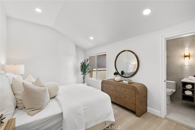 7 Sierra Vis, Laguna Niguel, CA 92677 - bedroom featuring lofted ceiling, light wood-type flooring, ensuite bath, and recessed lighting