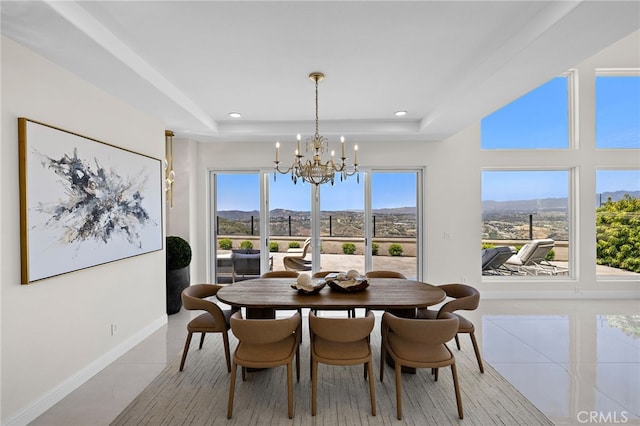7 Sierra Vis, Laguna Niguel, CA 92677 - dining space featuring a chandelier, a mountain view, a raised ceiling, recessed lighting, and light tile patterned floors