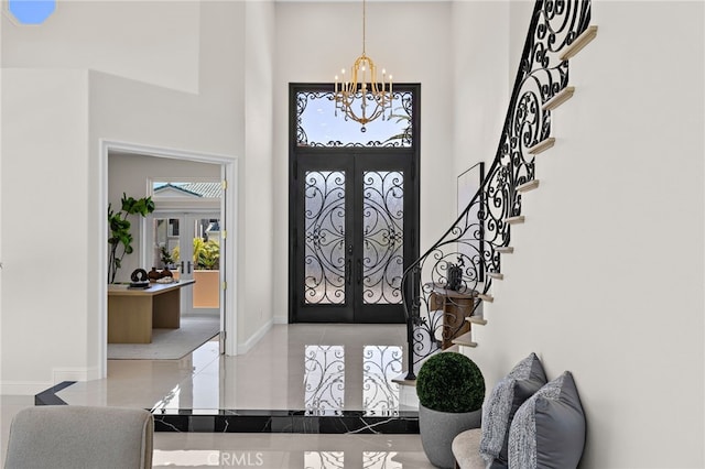 7 Sierra Vis, Laguna Niguel, CA 92677 - entrance foyer featuring french doors, a high ceiling, a chandelier, and plenty of natural light