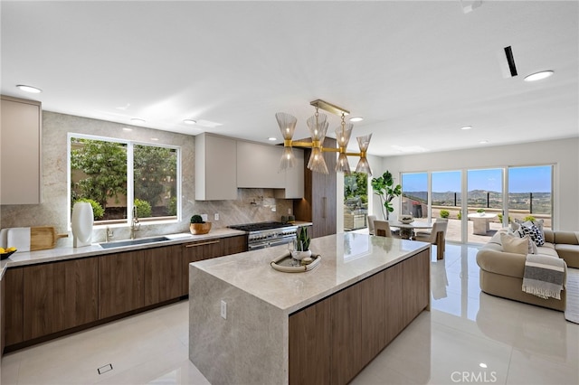 7 Sierra Vis, Laguna Niguel, CA 92677 - kitchen featuring double oven range, modern cabinets, a kitchen island, recessed lighting, and light tile patterned floors