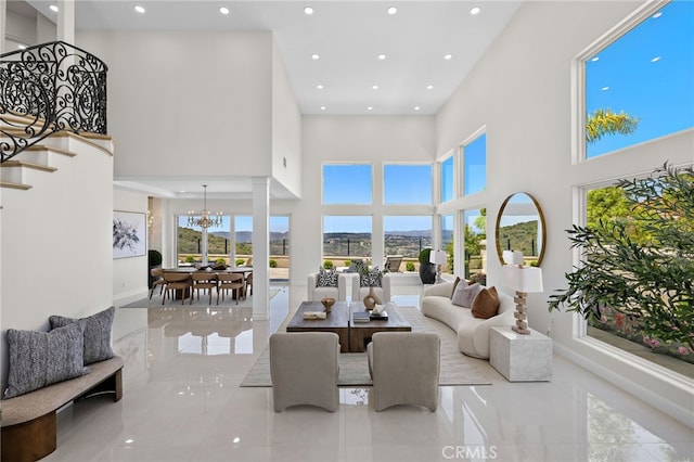 7 Sierra Vis, Laguna Niguel, CA 92677 - tiled living room featuring recessed lighting, a chandelier, a towering ceiling, and stairs