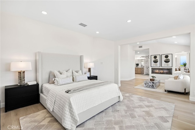 7 Sierra Vis, Laguna Niguel, CA 92677 - bedroom featuring light wood-type flooring, recessed lighting, and ensuite bath