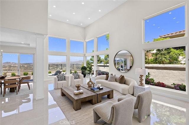 7 Sierra Vis, Laguna Niguel, CA 92677 - living area featuring tile patterned flooring, a high ceiling, recessed lighting, and a mountain view