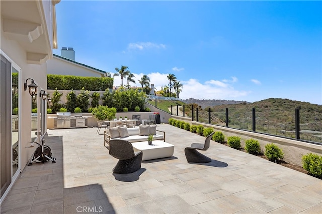 7 Sierra Vis, Laguna Niguel, CA 92677 - view of patio / terrace featuring exterior kitchen, a mountain view, and outdoor lounge area