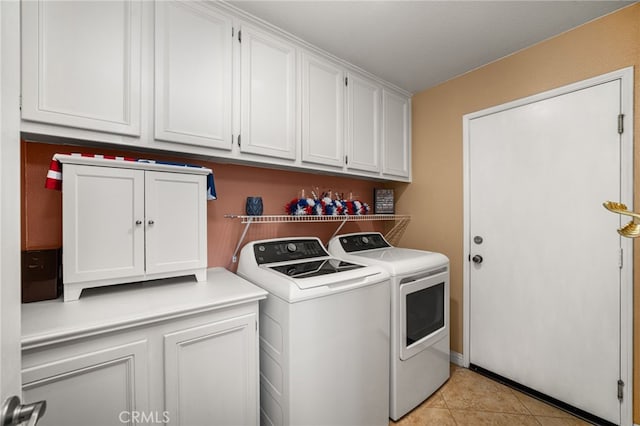 5601 Crestline Pl, Rancho Cucamonga, CA 91739 - washroom featuring washing machine and dryer, cabinet space, and light tile patterned floors