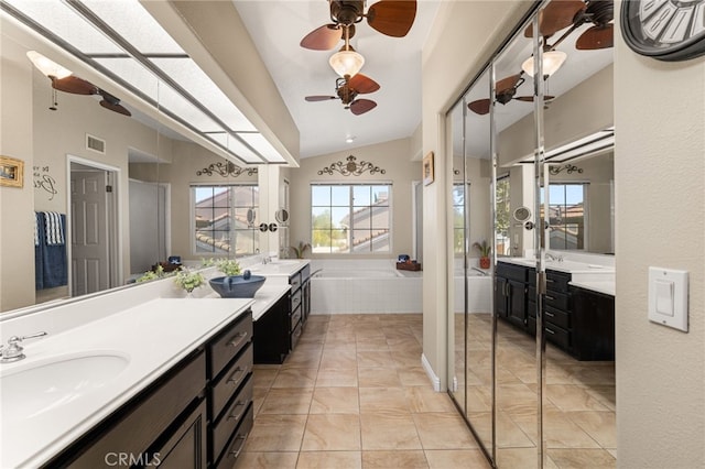 5601 Crestline Pl, Rancho Cucamonga, CA 91739 - full bath featuring a ceiling fan, vaulted ceiling, two vanities, and a bath
