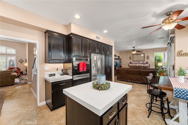 5601 Crestline Pl, Rancho Cucamonga, CA 91739 - kitchen featuring open floor plan, appliances with stainless steel finishes, ceiling fan, light countertops, and recessed lighting