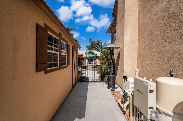 5601 Crestline Pl, Rancho Cucamonga, CA 91739 - view of side of property with stucco siding and a gate