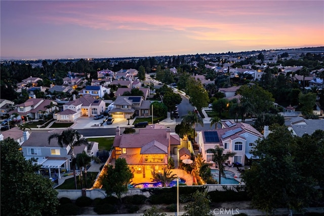 5601 Crestline Pl, Rancho Cucamonga, CA 91739 - aerial view at dusk of a residential view and view of pool