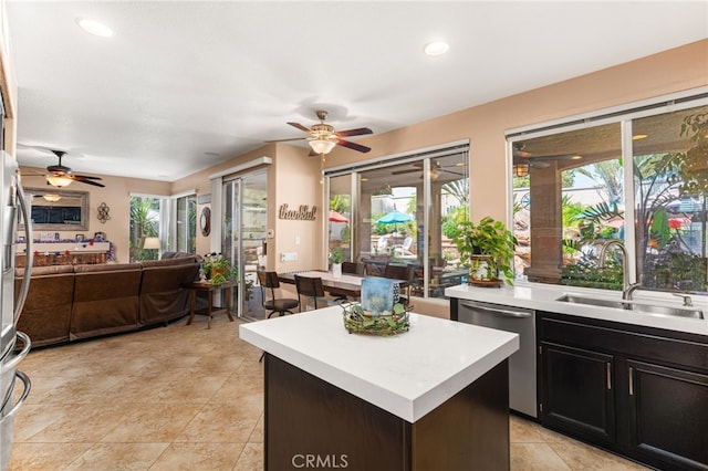 5601 Crestline Pl, Rancho Cucamonga, CA 91739 - kitchen featuring stainless steel dishwasher, ceiling fan, open floor plan, light countertops, and recessed lighting