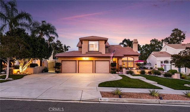 5601 Crestline Pl, Rancho Cucamonga, CA 91739 - view of front of property featuring a tile roof, stucco siding, an attached garage, driveway, and a chimney