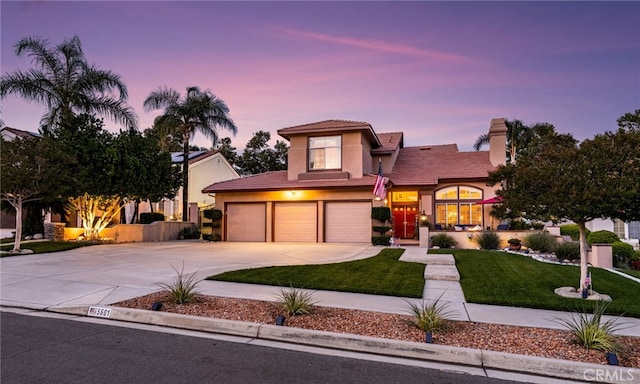 5601 Crestline Pl, Rancho Cucamonga, CA 91739 - view of front of property with concrete driveway, a lawn, stucco siding, a garage, and a tiled roof