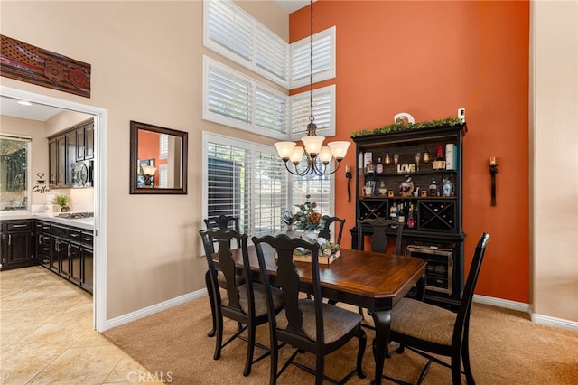 5601 Crestline Pl, Rancho Cucamonga, CA 91739 - dining space with a chandelier, a high ceiling, plenty of natural light, light carpet, and light tile patterned flooring