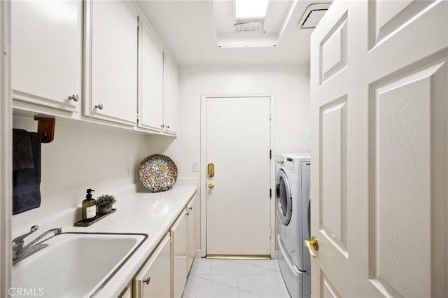 5914 Johnston Pl, Rancho Cucamonga, CA 91739 - laundry area with light marble finish flooring, cabinet space, and washing machine and clothes dryer