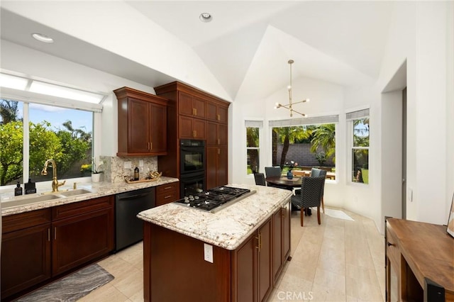 5914 Johnston Pl, Rancho Cucamonga, CA 91739 - kitchen with black appliances, plenty of natural light, a chandelier, light stone counters, and lofted ceiling
