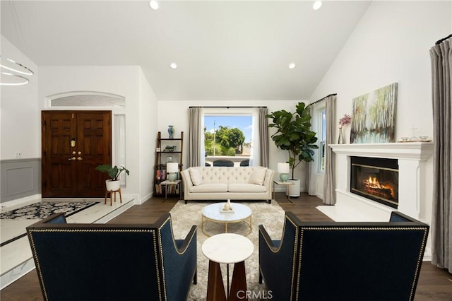 5914 Johnston Pl, Rancho Cucamonga, CA 91739 - living room featuring lofted ceiling, a glass covered fireplace, dark wood-style floors, and recessed lighting