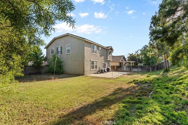 11868 Bunker Hill Dr, Rancho Cucamonga, CA 91730 - rear view of house with stucco siding and a patio