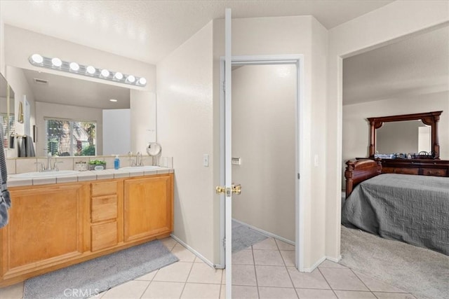 11868 Bunker Hill Dr, Rancho Cucamonga, CA 91730 - bathroom featuring ensuite bathroom, double vanity, and tile patterned flooring