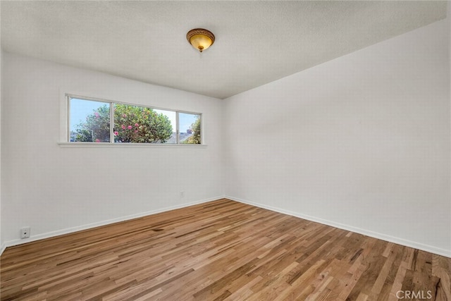 1014 W 185th St, Gardena, CA 90248 - empty room featuring wood finished floors and baseboards