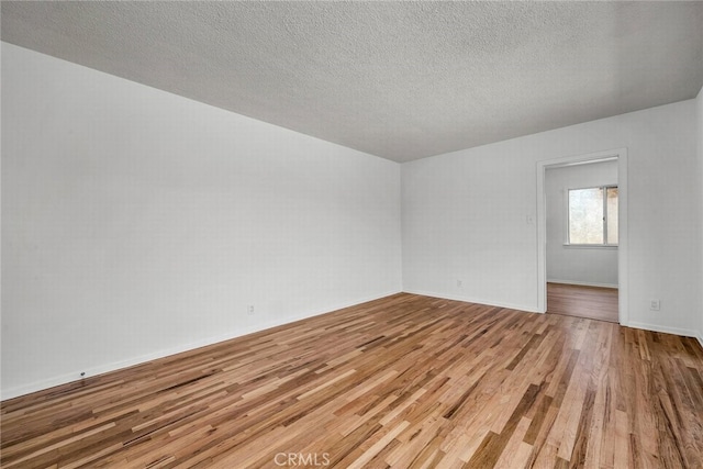 1014 W 185th St, Gardena, CA 90248 - spare room featuring wood finished floors and a textured ceiling