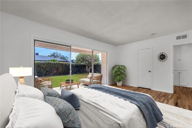 1014 W 185th St, Gardena, CA 90248 - bedroom featuring wood finished floors, a textured ceiling, and access to outside