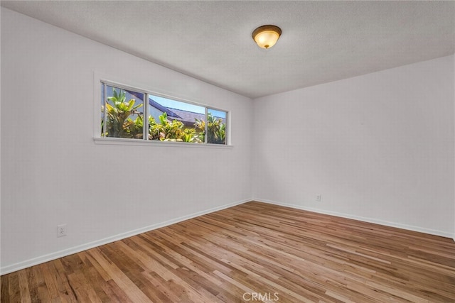 1014 W 185th St, Gardena, CA 90248 - spare room with wood finished floors and a textured ceiling