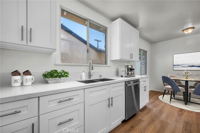 1014 W 185th St, Gardena, CA 90248 - kitchen with dishwasher, wood finished floors, white cabinets, and plenty of natural light