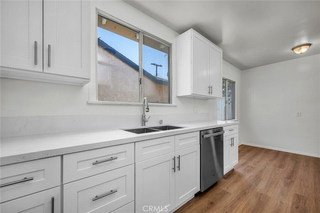 1014 W 185th St, Gardena, CA 90248 - kitchen featuring stainless steel dishwasher, dark wood-style floors, white cabinetry, light countertops, and healthy amount of natural light