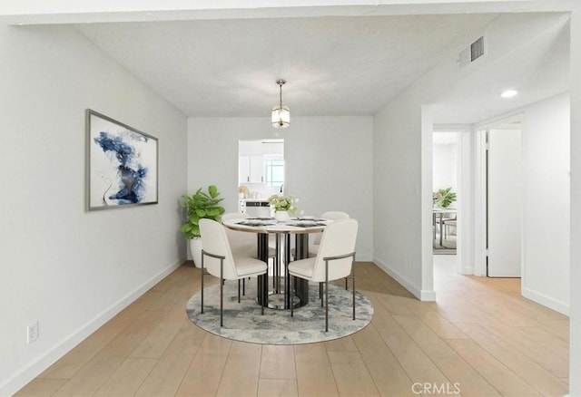 17742 Devonshire St Unit 3, Northridge, CA 91325 - dining room featuring light wood-style floors and baseboards