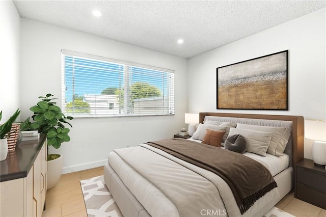 17742 Devonshire St Unit 3, Northridge, CA 91325 - bedroom featuring recessed lighting, a textured ceiling, and light tile patterned floors