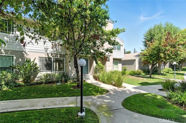 17742 Devonshire St Unit 3, Northridge, CA 91325 - view of front of house with a front yard and stucco siding