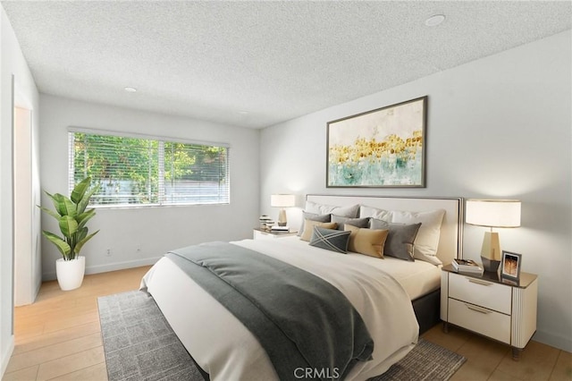 17742 Devonshire St Unit 3, Northridge, CA 91325 - bedroom featuring a textured ceiling and wood finished floors