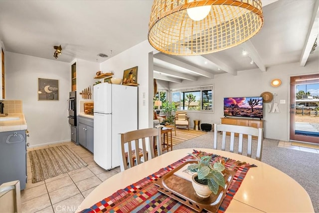 7638 Dumosa Ave, Yucca Valley, CA 92284 - dining space with light tile patterned floors and beam ceiling